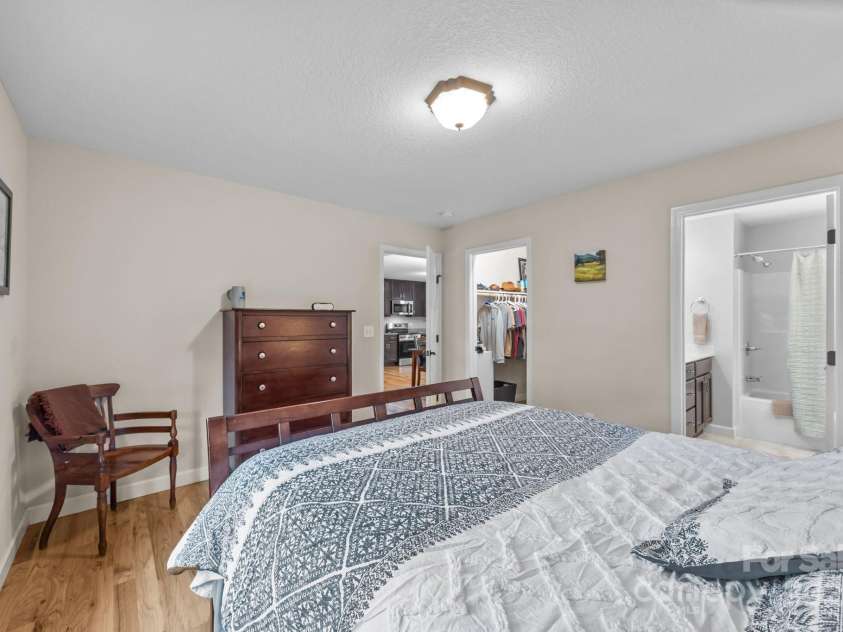 17 Laurel Road, Arden, NC 28704.  MLS# CAR4265020, YatesRealty ID 23009. Primary bedroom with walk-in closet and en-suite bath
