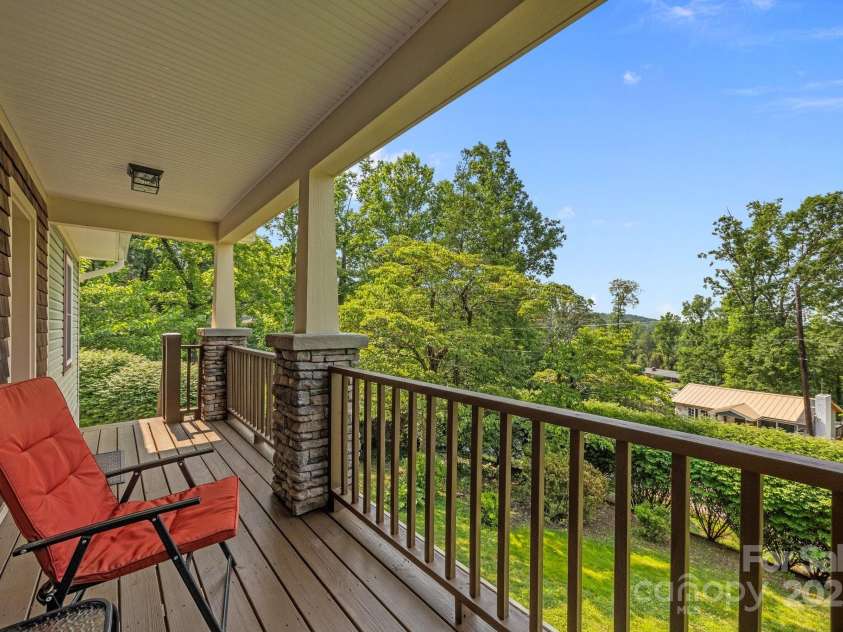 17 Laurel Road, Arden, NC 28704.  MLS# CAR4265020, YatesRealty ID 23009. Private covered front porch with mountain view