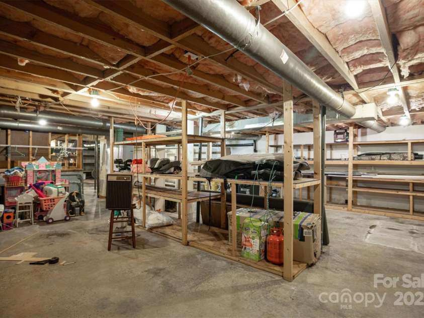 3452 Tranquil Hills Drive, Lenoir, NC 28645.  MLS# CAR4264787, YatesRealty ID 23011. Basement storage area