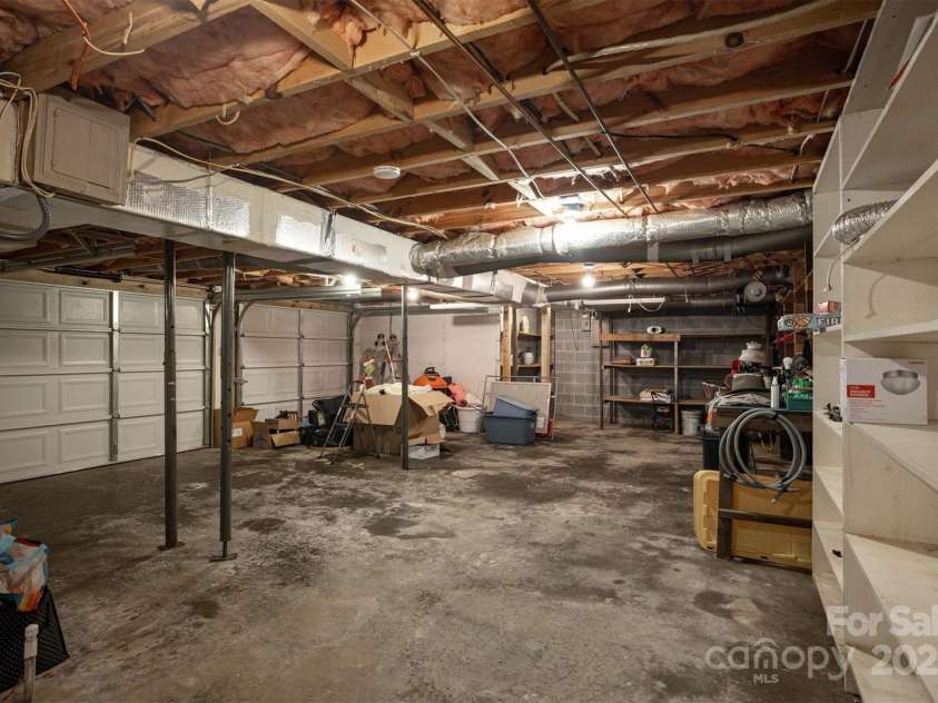 3452 Tranquil Hills Drive, Lenoir, NC 28645.  MLS# CAR4264787, YatesRealty ID 23011. Basement/2 car garage and work bench