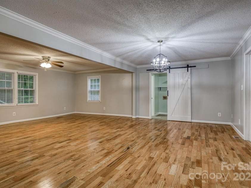 3452 Tranquil Hills Drive, Lenoir, NC 28645.  MLS# CAR4264787, YatesRealty ID 23011. Living room and dinning area