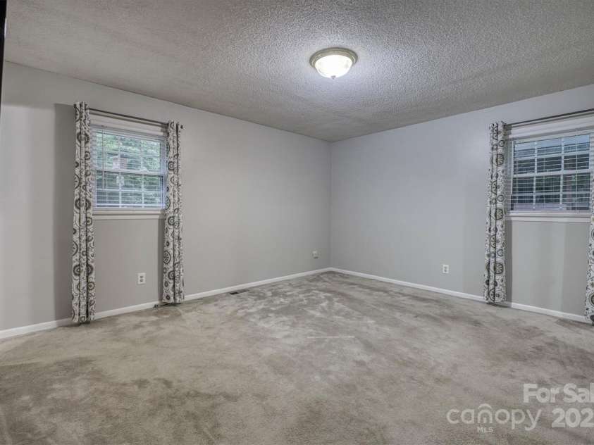 3452 Tranquil Hills Drive, Lenoir, NC 28645.  MLS# CAR4264787, YatesRealty ID 23011. Primary bedroom