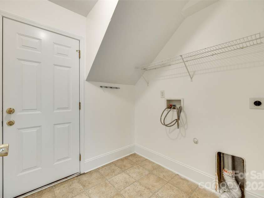 1835 Montague Road, Clover, SC 29710.  MLS# CAR4252009, YatesRealty ID 23014. Laundry Room Leading To Garage