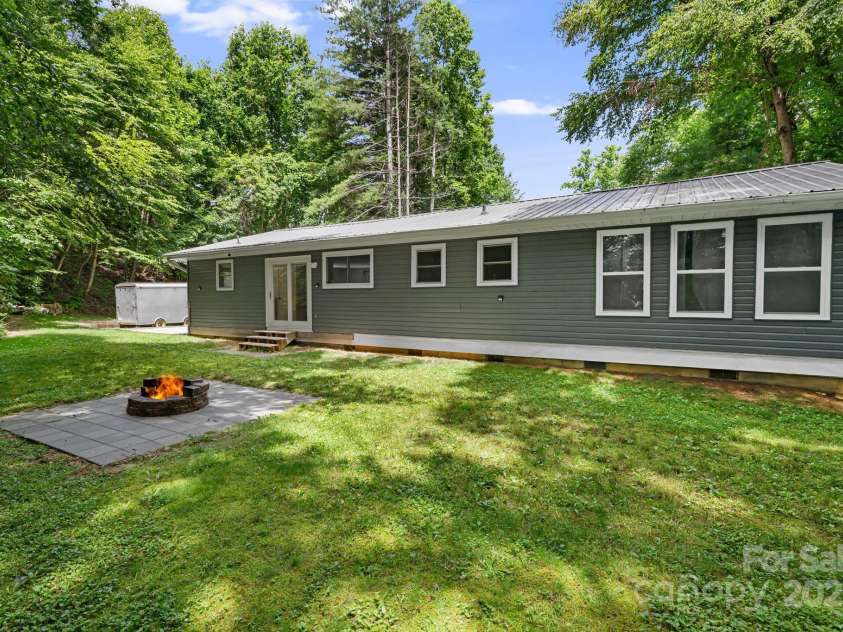 487 Duncan Creek Road, Fletcher, NC 28732.  MLS# CAR4269119, YatesRealty ID 23016. Back Yard & Fire Pit Area