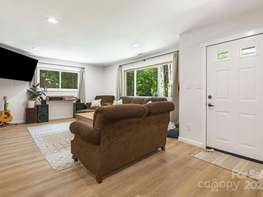 487 Duncan Creek Road, Fletcher, NC 28732.  MLS# CAR4269119, YatesRealty ID 23016. Bright Living Space with New Floors Throughout