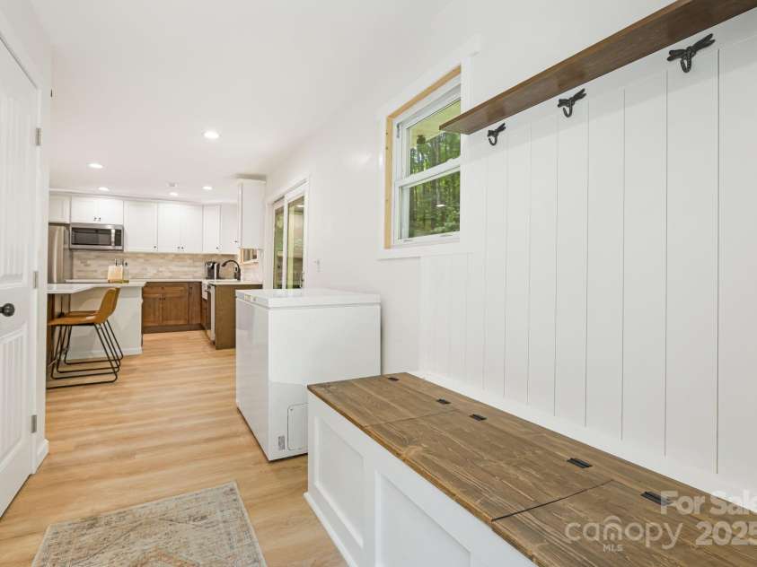 487 Duncan Creek Road, Fletcher, NC 28732.  MLS# CAR4269119, YatesRealty ID 23016. Organized Mud Room at Side Entry with Built-In Bench & Hooks