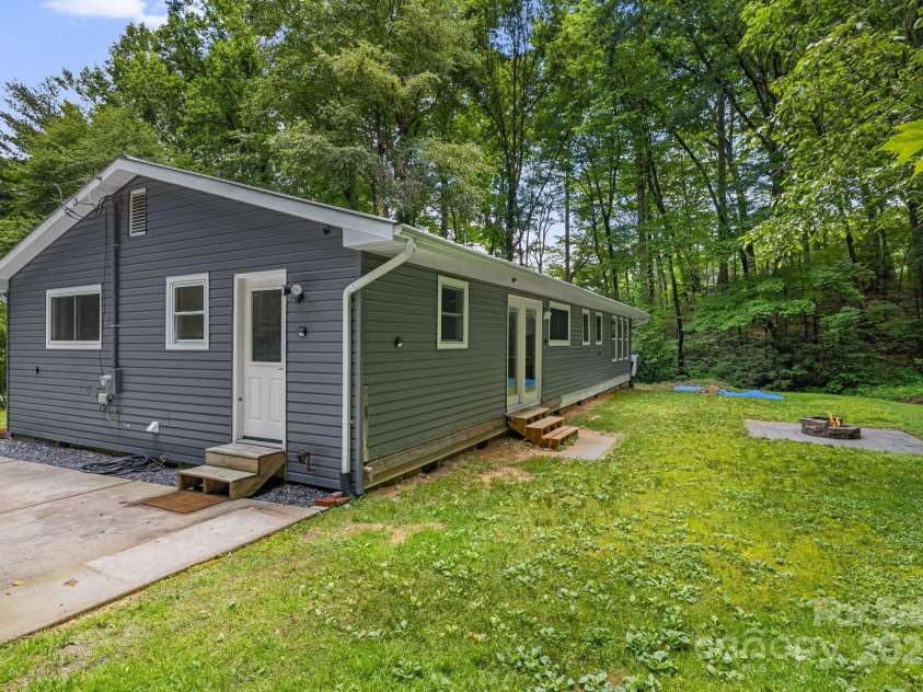 487 Duncan Creek Road, Fletcher, NC 28732.  MLS# CAR4269119, YatesRealty ID 23016. Side Yard with Mature Trees