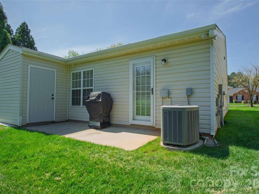 5320 Harris Cove Drive, Charlotte, NC 28269.  MLS# CAR4355819, YatesRealty ID 23017. Rear patio and storage closet. 