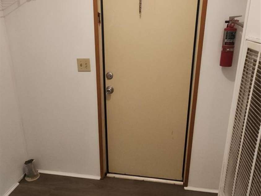 67 Brown Lynch Road, Candler, NC 28715.  MLS# CAR4270634, YatesRealty ID 23018. Back door in laundry room