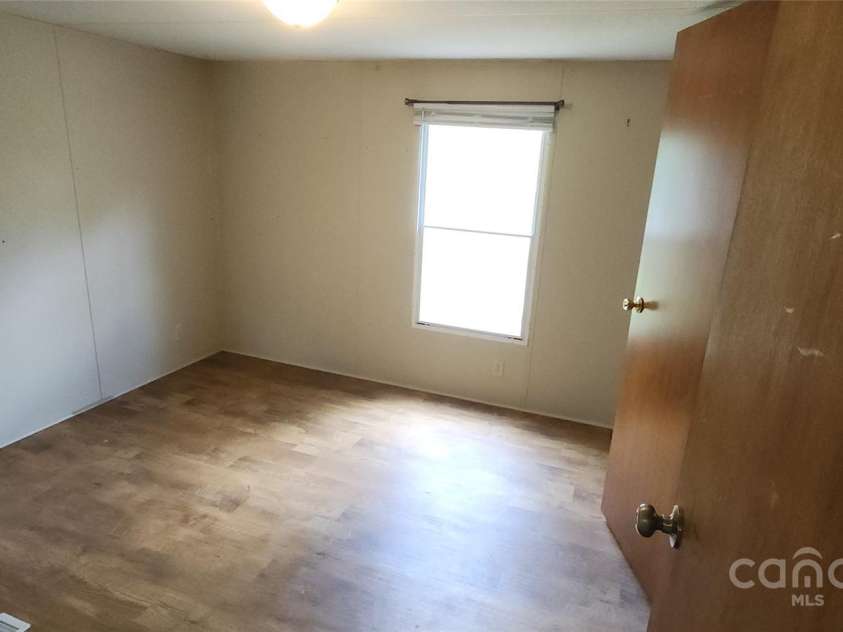 67 Brown Lynch Road, Candler, NC 28715.  MLS# CAR4270634, YatesRealty ID 23018. Bedroom 2