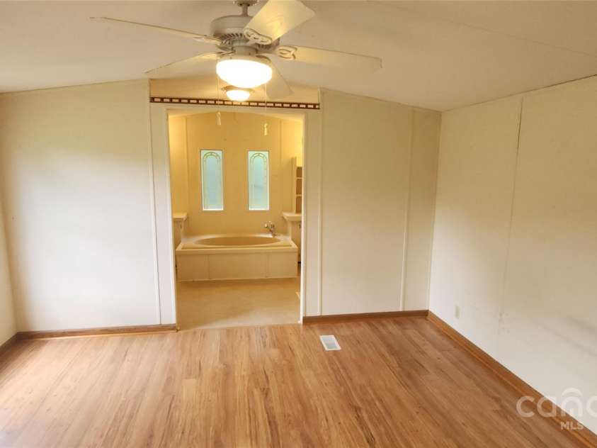 67 Brown Lynch Road, Candler, NC 28715.  MLS# CAR4270634, YatesRealty ID 23018. Primary bedroom