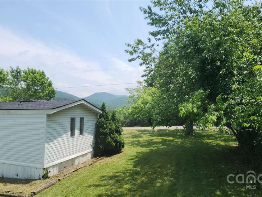 67 Brown Lynch Road, Candler, NC 28715.  MLS# CAR4270634, YatesRealty ID 23018. Side yard with views