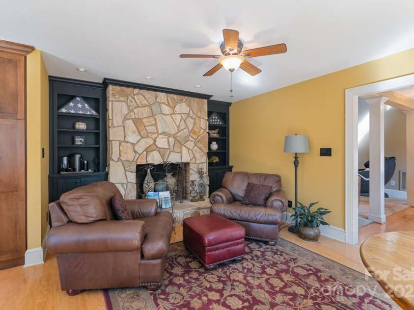 3406 Red Fox Trail, Weddington, NC 28104.  MLS# CAR4214440, YatesRealty ID 2302. Breakfast area with seating area, built-ins and wood burning Rock Fireplace
