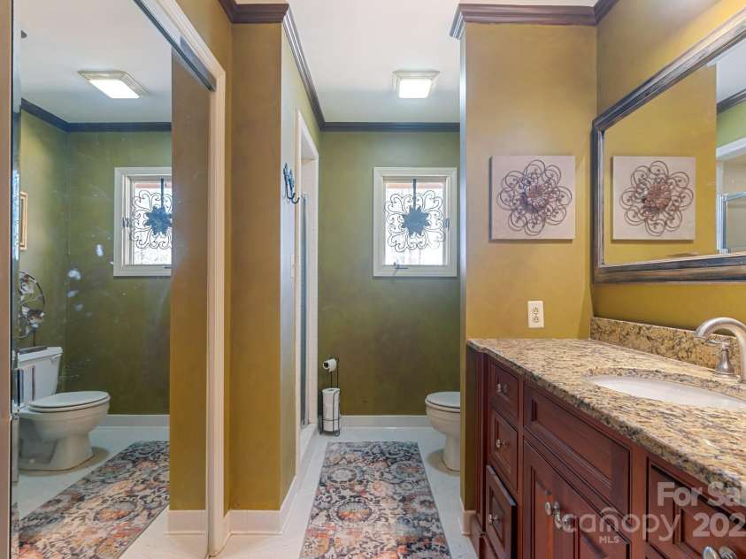 3406 Red Fox Trail, Weddington, NC 28104.  MLS# CAR4214440, YatesRealty ID 2302. Primary Bath with tile and custom vanity
