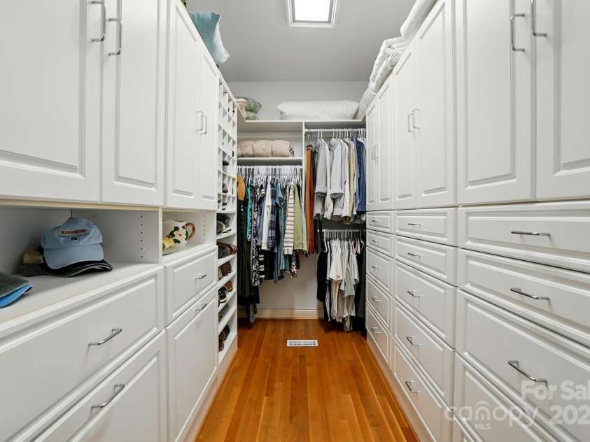 1042 Heather Glen Drive, Matthews, NC 28104.  MLS# CAR4270190, YatesRealty ID 23020. Primary Closet w/ Custom Cabinetry