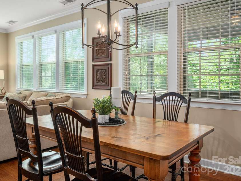 1805 Trading Path Lane, Waxhaw, NC 28173.  MLS# CAR4273259, YatesRealty ID 23032. Dining area overlooks screened porch and beautiful greenery in rear yard