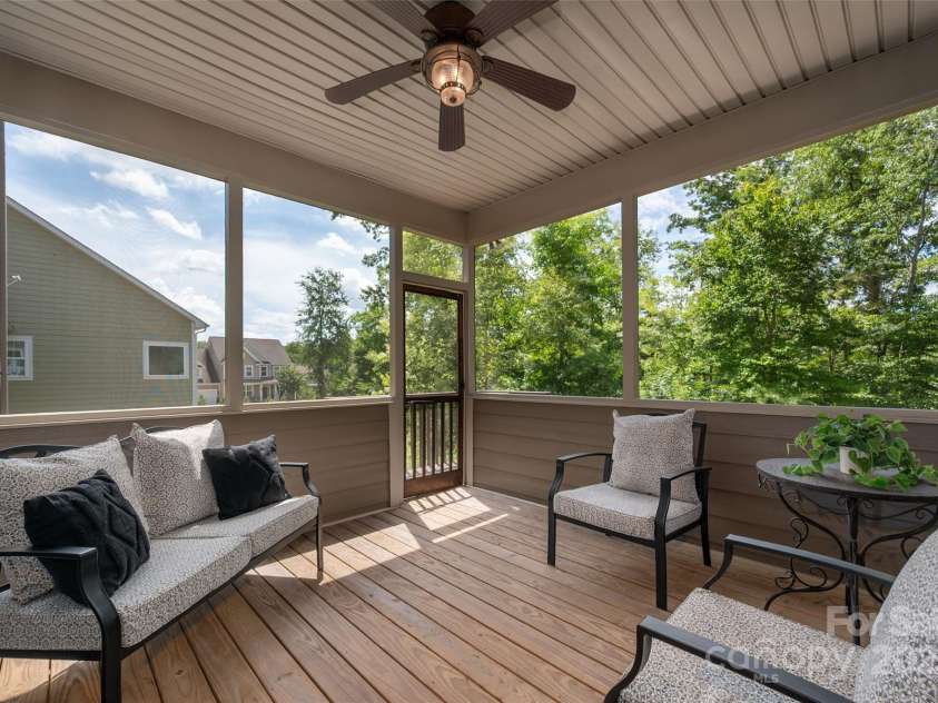 1805 Trading Path Lane, Waxhaw, NC 28173.  MLS# CAR4273259, YatesRealty ID 23032. Screened in deck over looking the beautiful rear yard.