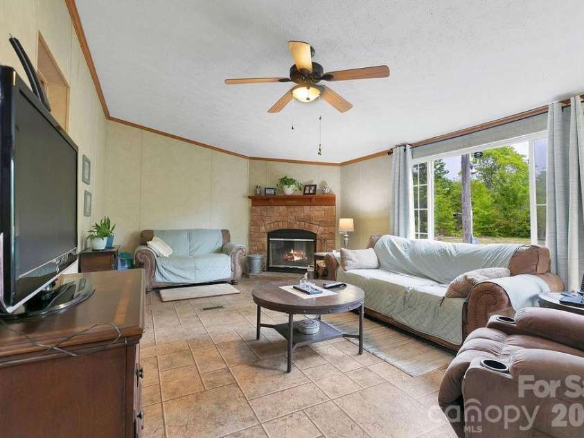 111 Wild Hog Creek Road, Rosman, NC 28772.  MLS# CAR4380401, YatesRealty ID 23035. Cozy Fireplace