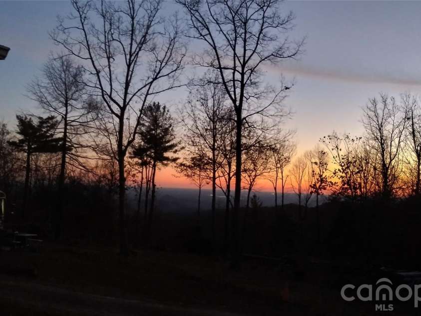 111 Wild Hog Creek Road, Rosman, NC 28772.  MLS# CAR4380401, YatesRealty ID 23035. Gorgeous Sunrise