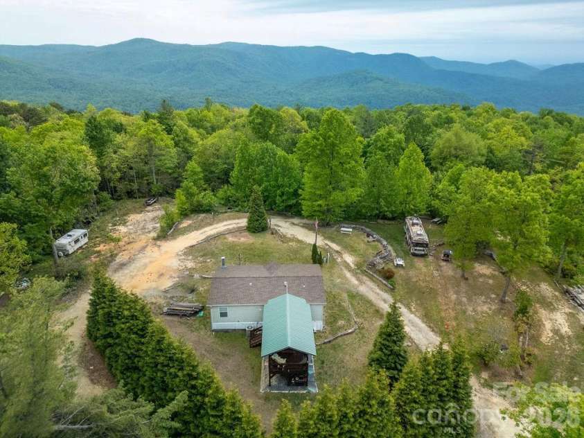111 Wild Hog Creek Road, Rosman, NC 28772.  MLS# CAR4380401, YatesRealty ID 23035. Mountaintop Home