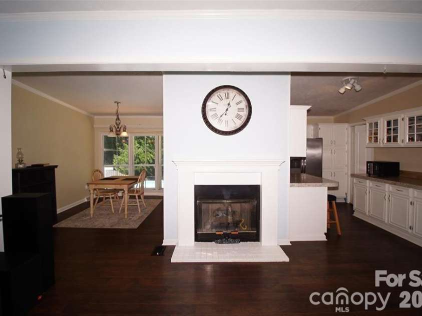7010 Executive Circle, Denver, NC 28037.  MLS# CAR4383024, YatesRealty ID 23040. Living room fireplace