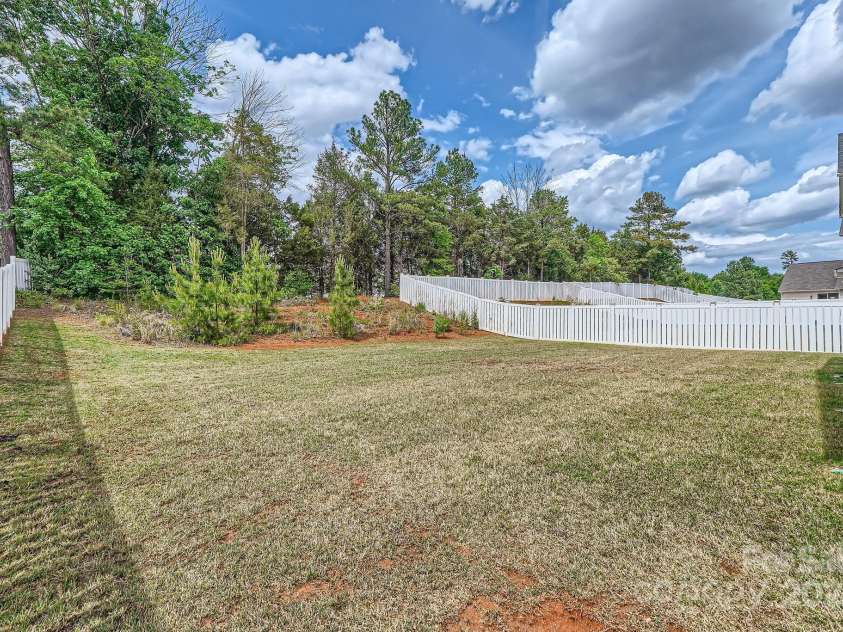 8726 Addingham Drive, Charlotte, NC 28269.  MLS# CAR4257512, YatesRealty ID 23040. Backyard