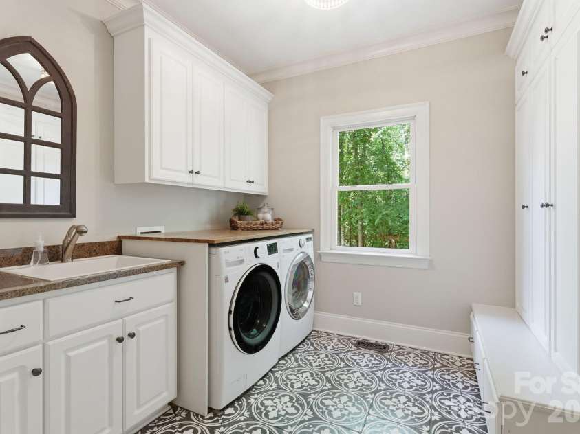 235 Grey Road, Davidson, NC 28036.  MLS# CAR4382846, YatesRealty ID 23048. Main level laundry