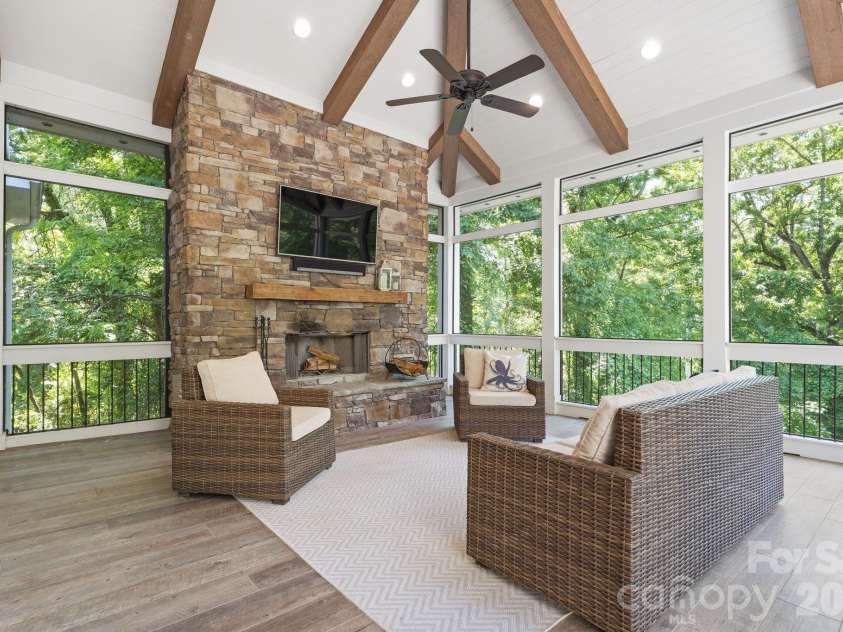 235 Grey Road, Davidson, NC 28036.  MLS# CAR4382846, YatesRealty ID 23048. Main level screened porch with fireplace