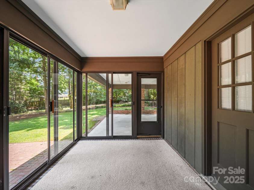 2104 Stoneyridge Drive, Charlotte, NC 28214.  MLS# CAR4275022, YatesRealty ID 23053. Enclosed back porch