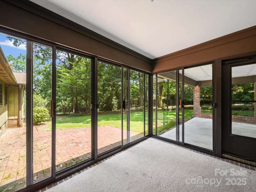 2104 Stoneyridge Drive, Charlotte, NC 28214.  MLS# CAR4275022, YatesRealty ID 23053. Enclosed back porch