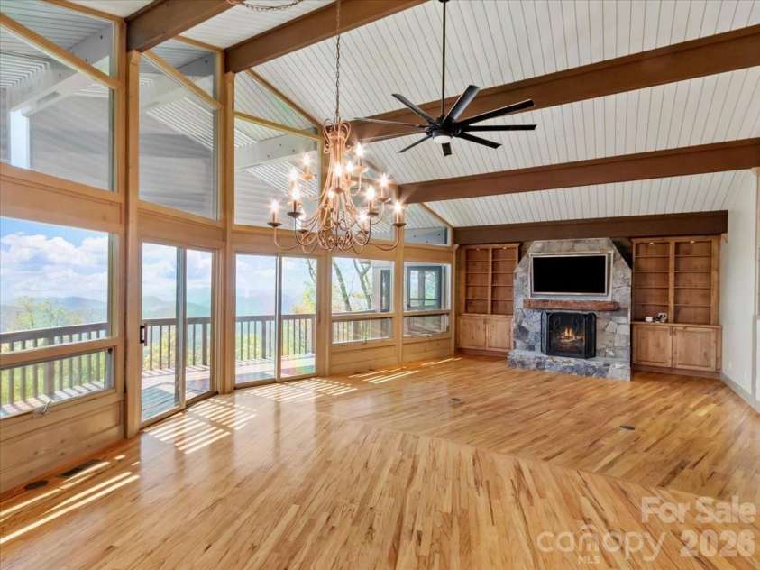 218 Slickrock Road, Burnsville, NC 28714.  MLS# CAR4377114, YatesRealty ID 23061. OPEN CONCEPT, EXPOSED BEAMS & STONE FP