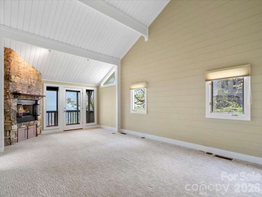 218 Slickrock Road, Burnsville, NC 28714.  MLS# CAR4377114, YatesRealty ID 23061. PRIMARY BDRM WITH VAULTED CEILING AND FP