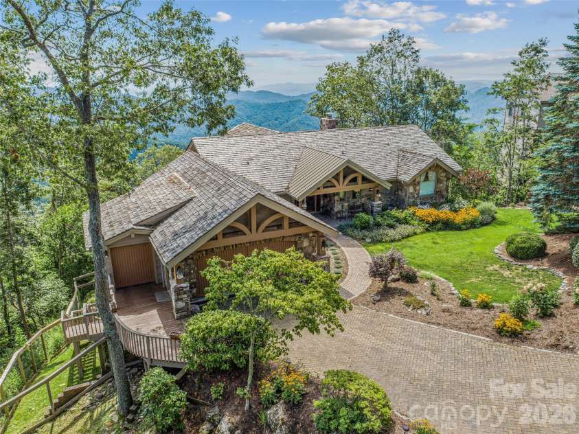 218 Slickrock Road, Burnsville, NC 28714.  MLS# CAR4377114, YatesRealty ID 23061. SIDE VIEW; GOLF CART & OVERSIZED TWO CAR GARAGE