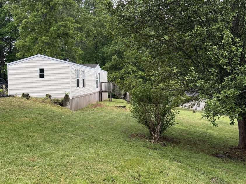 111 Otter Ridge Drive, Leicester, NC 28748.  MLS# CAR4378158, YatesRealty ID 23068. Side Yard