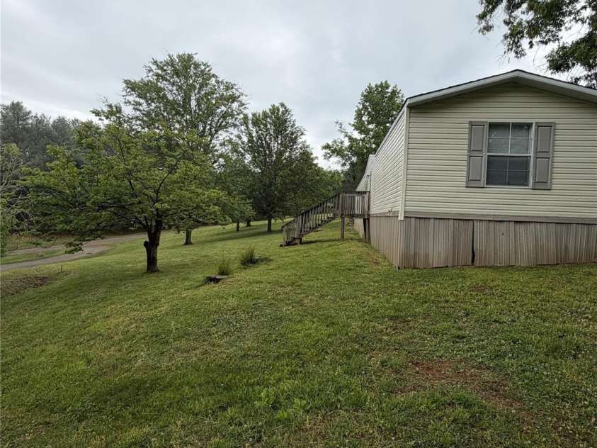 111 Otter Ridge Drive, Leicester, NC 28748.  MLS# CAR4378158, YatesRealty ID 23068. Side Yard
