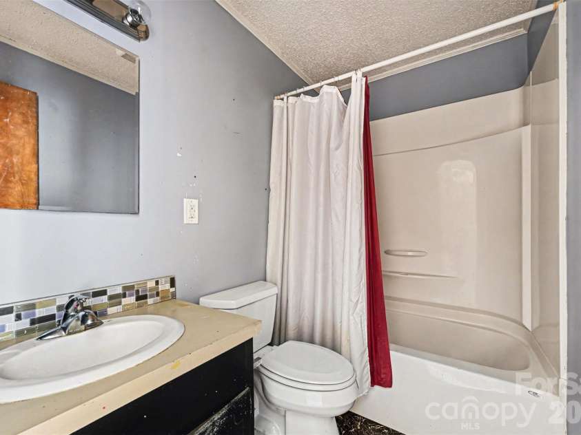 4650 Windy Road, Concord, NC 28027.  MLS# CAR4347275, YatesRealty ID 2307. Hall bath in brick house