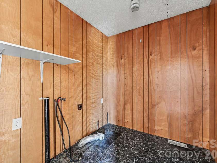 4650 Windy Road, Concord, NC 28027.  MLS# CAR4347275, YatesRealty ID 2307. Laundry room in brick house