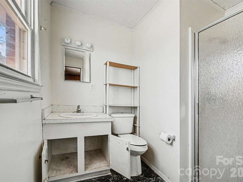 4650 Windy Road, Concord, NC 28027.  MLS# CAR4347275, YatesRealty ID 2307. Primary bath in brick house
