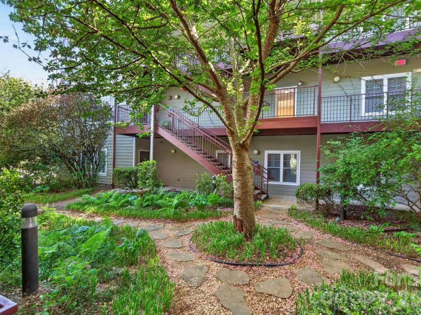 64 Clingman Avenue, Asheville, NC 28801.  MLS# CAR4371105, YatesRealty ID 23076. Inviting central courtyard