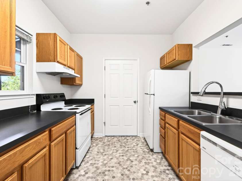 64 Clingman Avenue, Asheville, NC 28801.  MLS# CAR4371105, YatesRealty ID 23076. Kitchen with ample cabinet space.