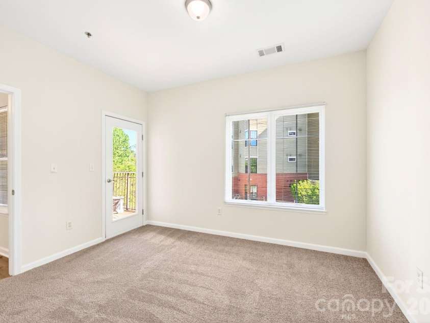 64 Clingman Avenue, Asheville, NC 28801.  MLS# CAR4371105, YatesRealty ID 23076. Private balcony access from primary bedroom.