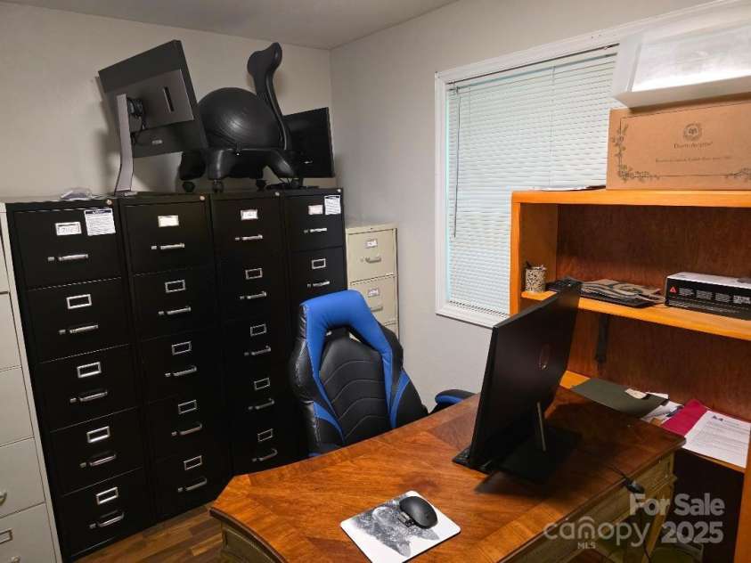 14 Yellow Brick Lane, Burnsville, NC 28714.  MLS# CAR4273450, YatesRealty ID 23082. Back corner of the primary bedroom