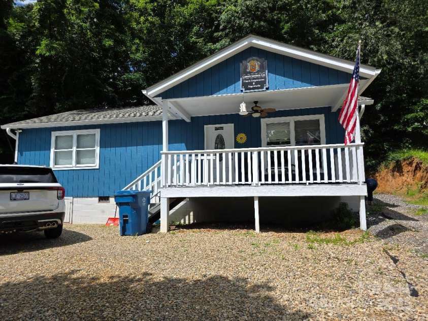 14 Yellow Brick Lane, Burnsville, NC 28714.  MLS# CAR4273450, YatesRealty ID 23082. Front of the house with covered deck/porch