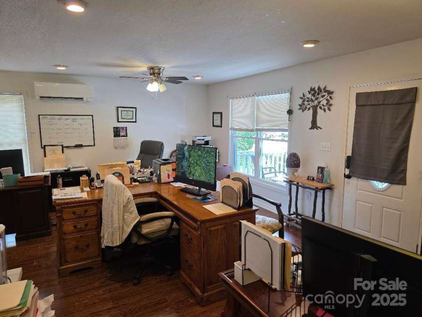 14 Yellow Brick Lane, Burnsville, NC 28714.  MLS# CAR4273450, YatesRealty ID 23082. Great room/living room with new recessed lighting. Kitchen and dining area is open to the great room.