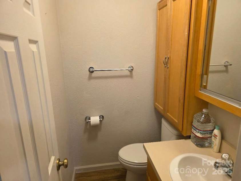 14 Yellow Brick Lane, Burnsville, NC 28714.  MLS# CAR4273450, YatesRealty ID 23082. Half bathroom off of bedroom