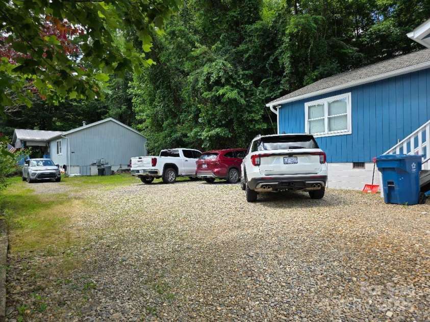 14 Yellow Brick Lane, Burnsville, NC 28714.  MLS# CAR4273450, YatesRealty ID 23082. View of the parking area and the house that shares a driveway with the listing