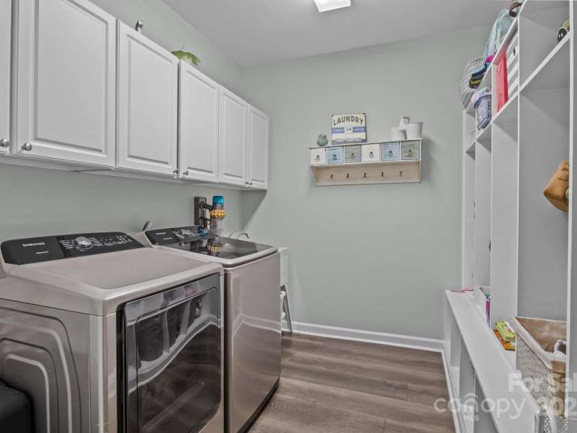 9412 Rosalyn Glen Road, Cornelius, NC 28031.  MLS# CAR4268548, YatesRealty ID 23086. This laundry room includes a drop zone and a sink!!