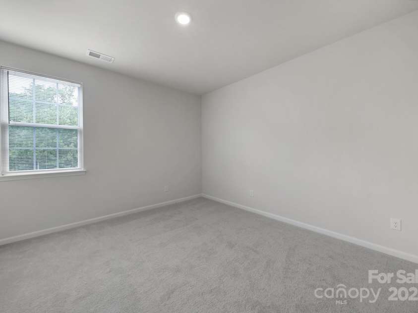 300 Kennerly Center Drive, Mooresville, NC 28115.  MLS# CAR4264019, YatesRealty ID 23089. Main Level Guest Bedroom