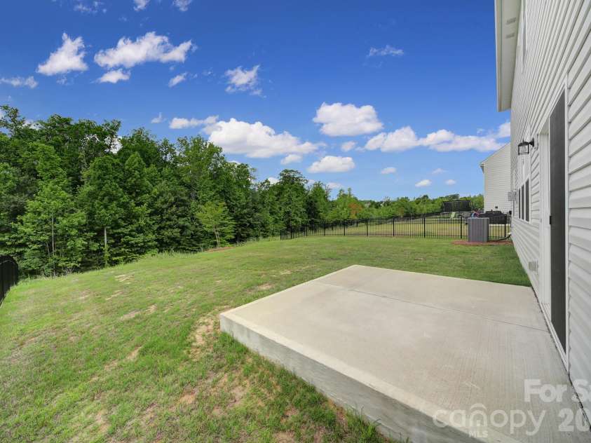 300 Kennerly Center Drive, Mooresville, NC 28115.  MLS# CAR4334795, YatesRealty ID 23089. Tree-lined Backyard