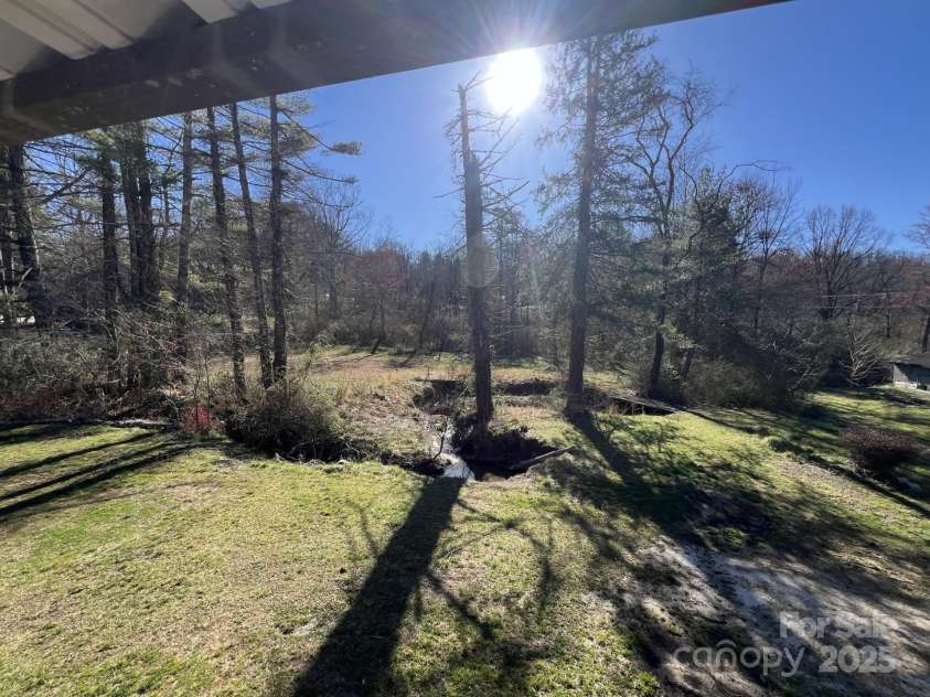 1757 Rosman Highway, Brevard, NC 28712.  MLS# CAR4234818, YatesRealty ID 2310. Awesome Back Yard